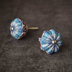 white and blue ceramic flower knob